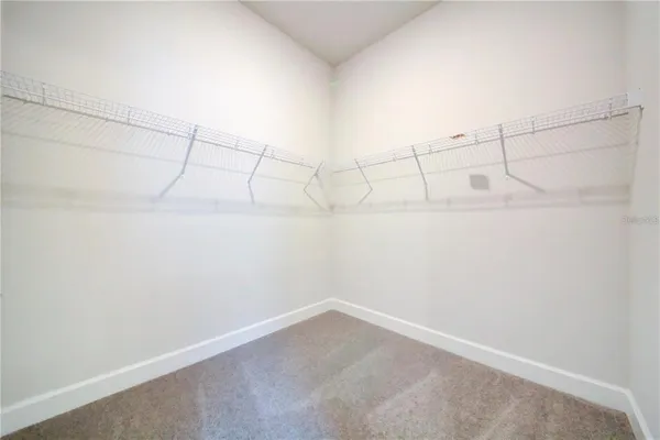 a view of a room with racks on the wall