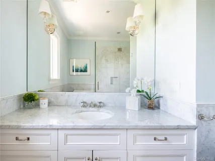 a bathroom with sink and mirror