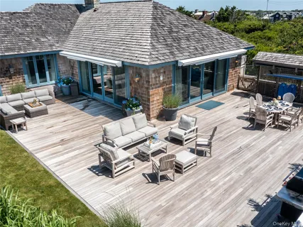 a outdoor space with patio furniture and garden view