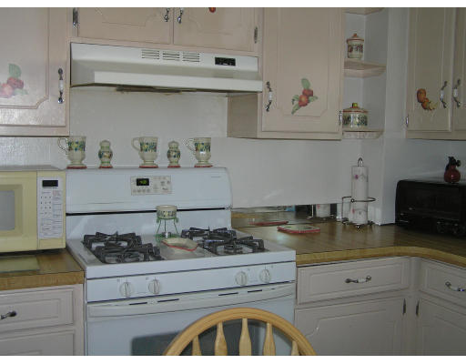 207 Prentice Street Springfield, MA 01104 - Photo 11 of 21 a kitchen with a stove and cabinets
