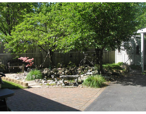 207 Prentice Street Springfield, MA 01104 - Photo 7 of 21 a view of a house with a yard and tree s
