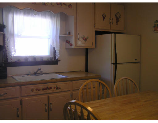 207 Prentice Street Springfield, MA 01104 - Photo 10 of 21 a kitchen with a refrigerator and a sink