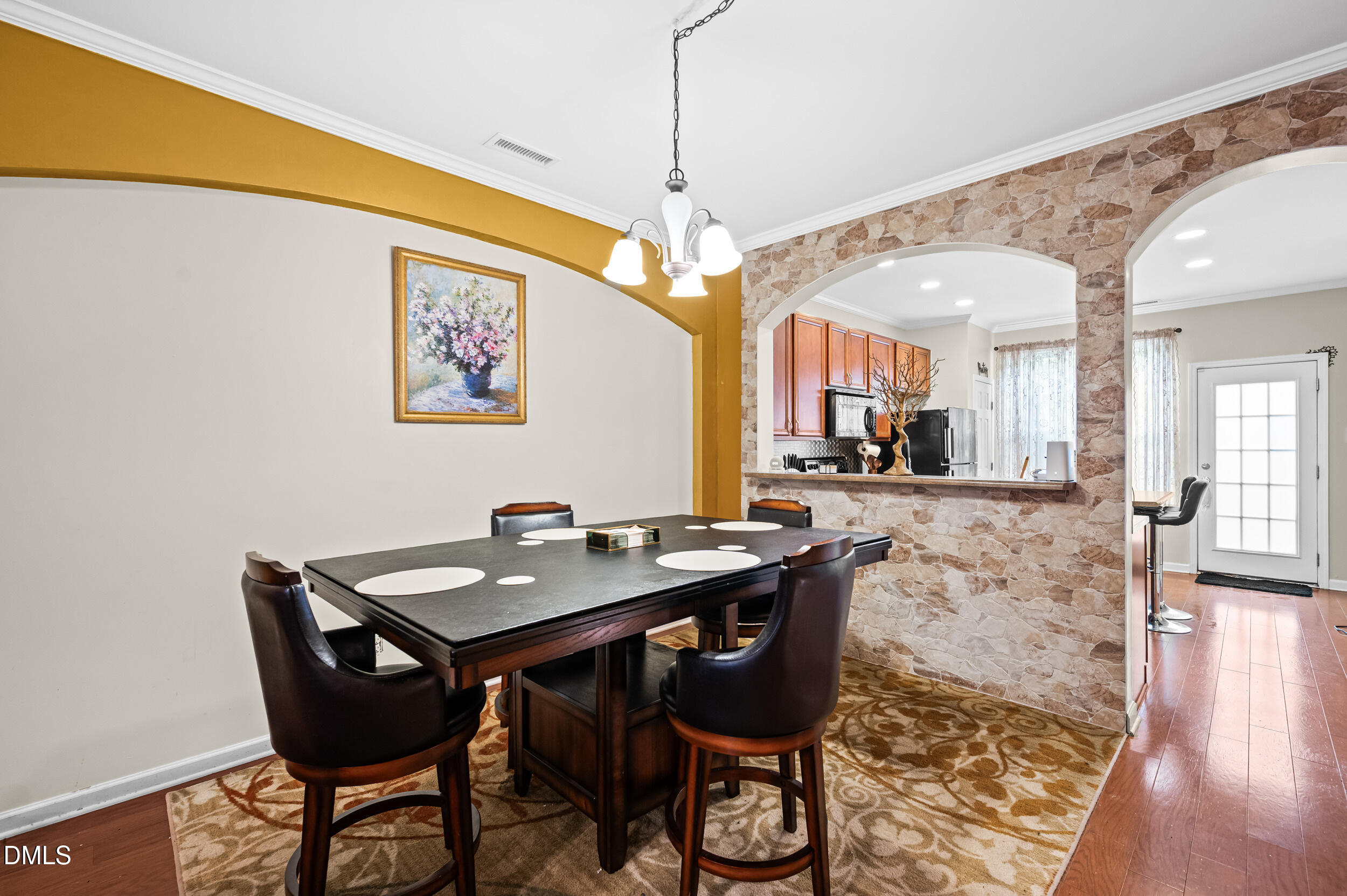 2944 Casona Way Raleigh, NC 27616 - Photo 6 of 24 a view of a dining room with furniture and wooden floor
