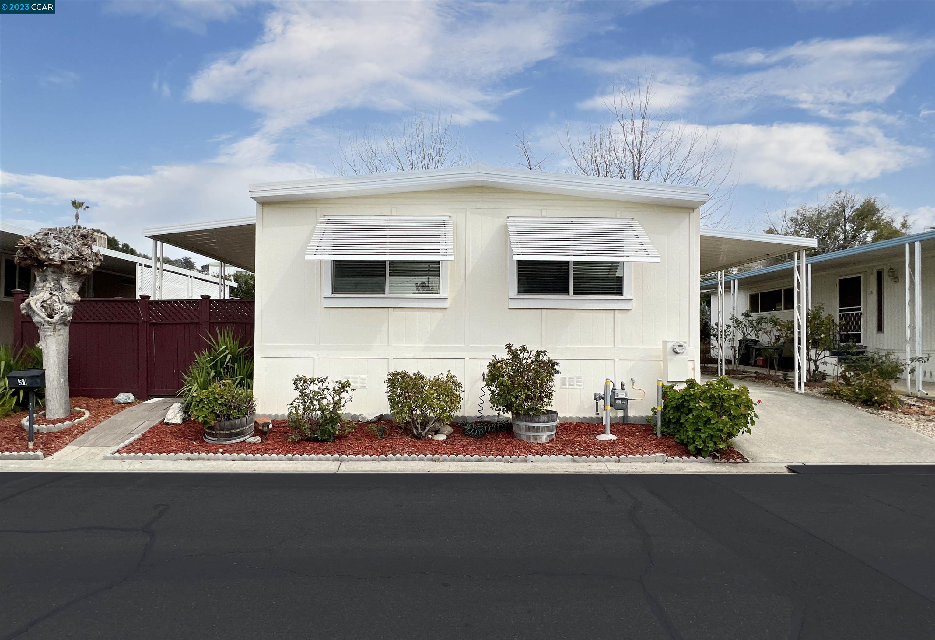 a front view of a house with yard