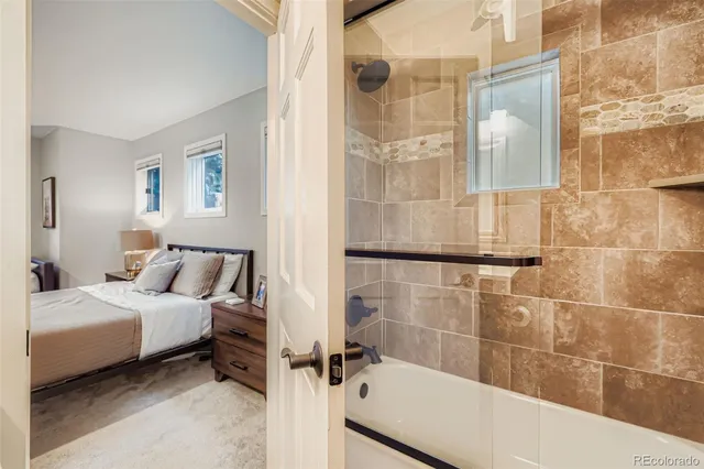 a bathroom with a bathtub and shower