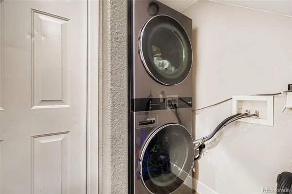 a view of a hallway with washer and dryer