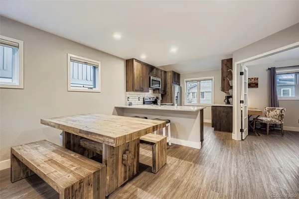 a open kitchen with a table and chairs