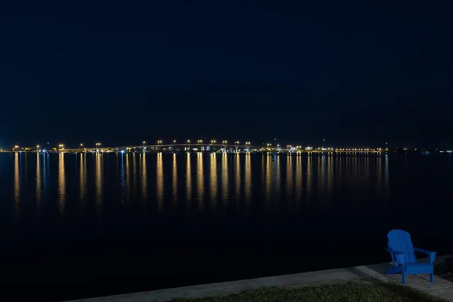 a front view of a house with a garden and patio
