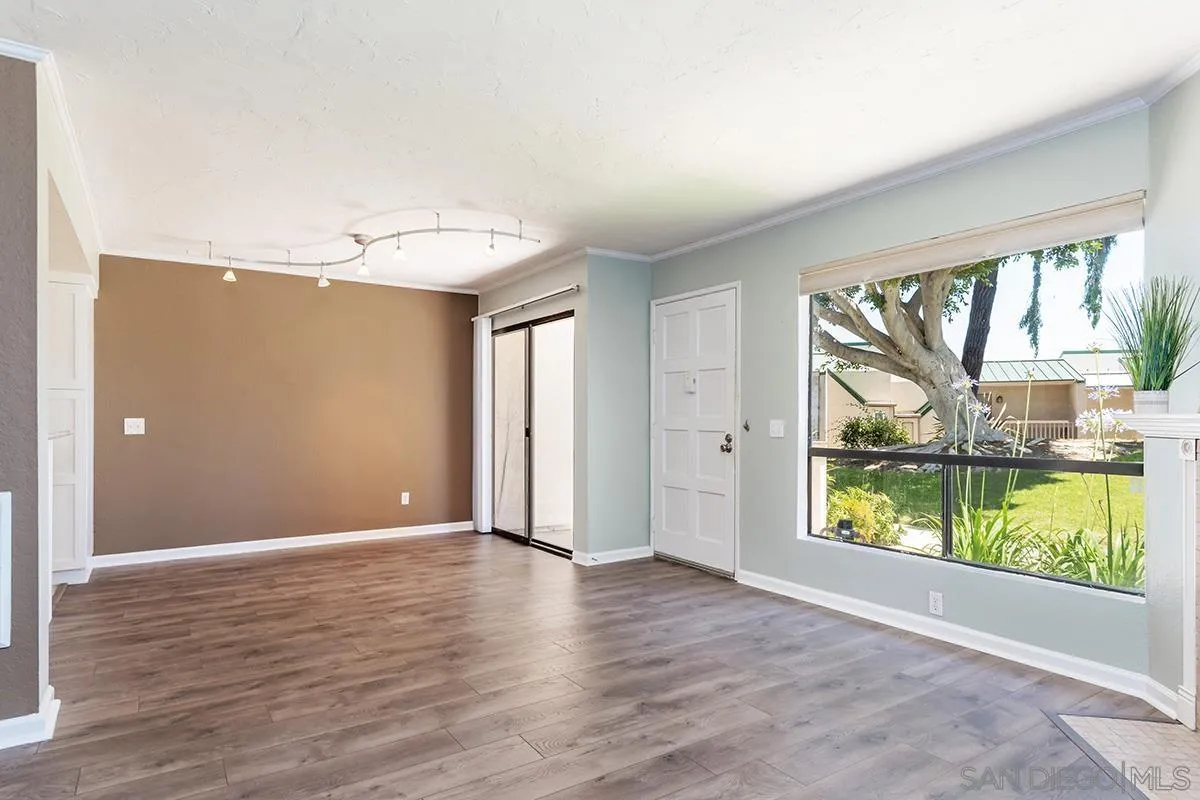 705 Copper Drive Vista, CA 92083 - Photo 13 of 31 wooden floor in an empty room with a window