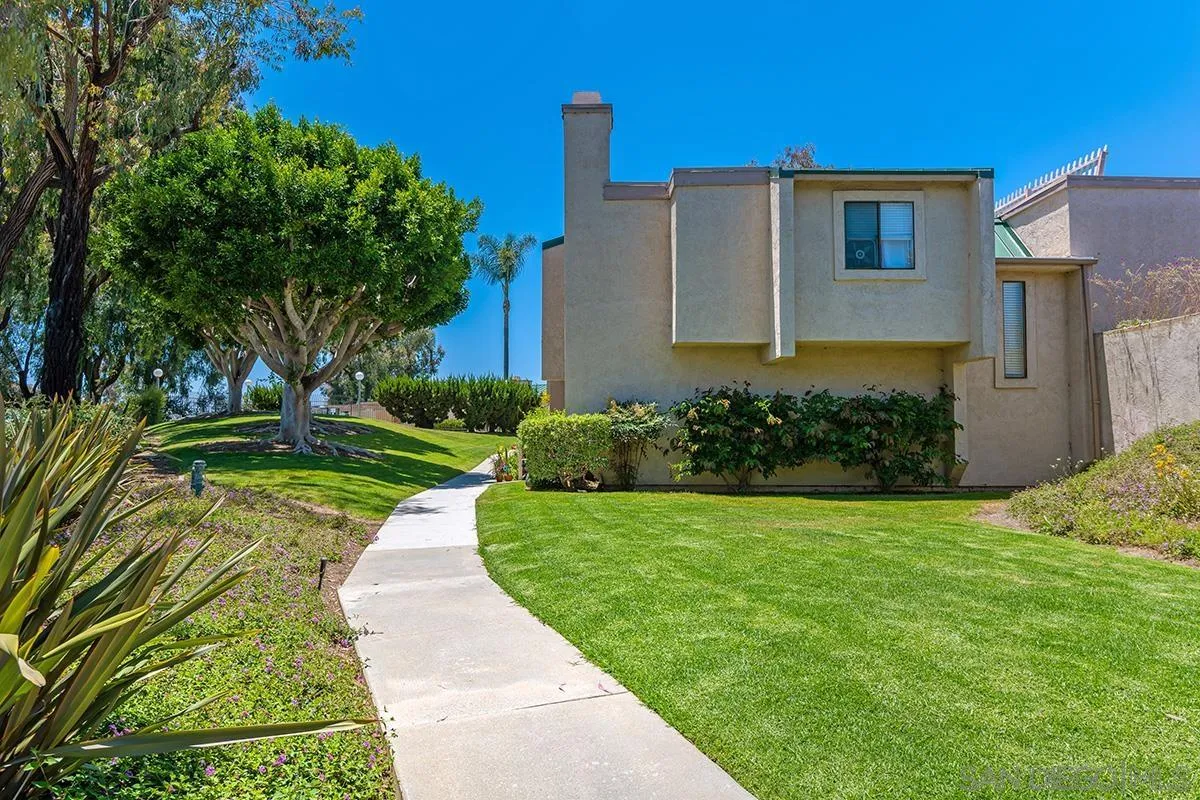 705 Copper Drive Vista, CA 92083 - Photo 27 of 31 a front view of a house with a yard