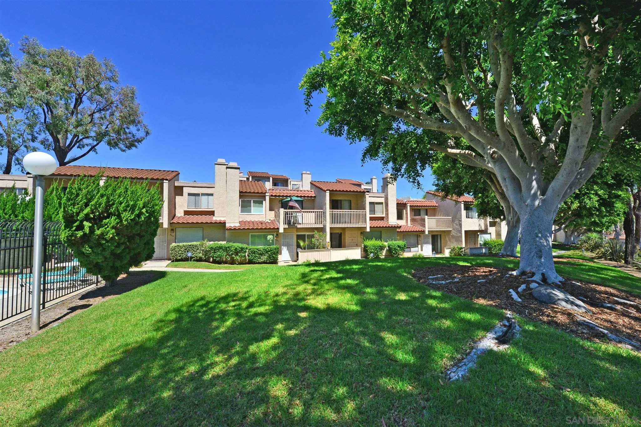 705 Copper Drive Vista, CA 92083 - Photo 30 of 31 a view of a house with a yard