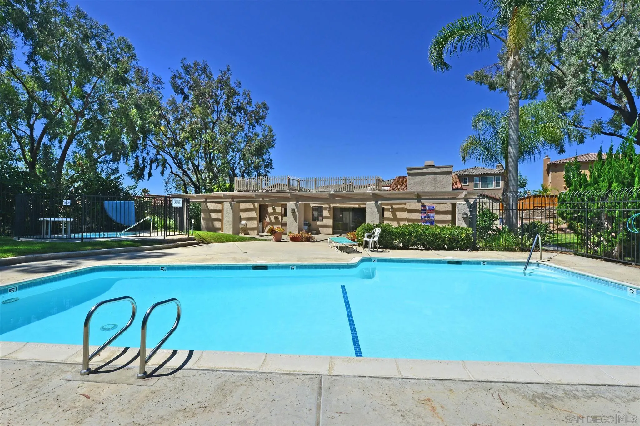 705 Copper Drive Vista, CA 92083 - Photo 31 of 31 a view of a swimming pool with a bench