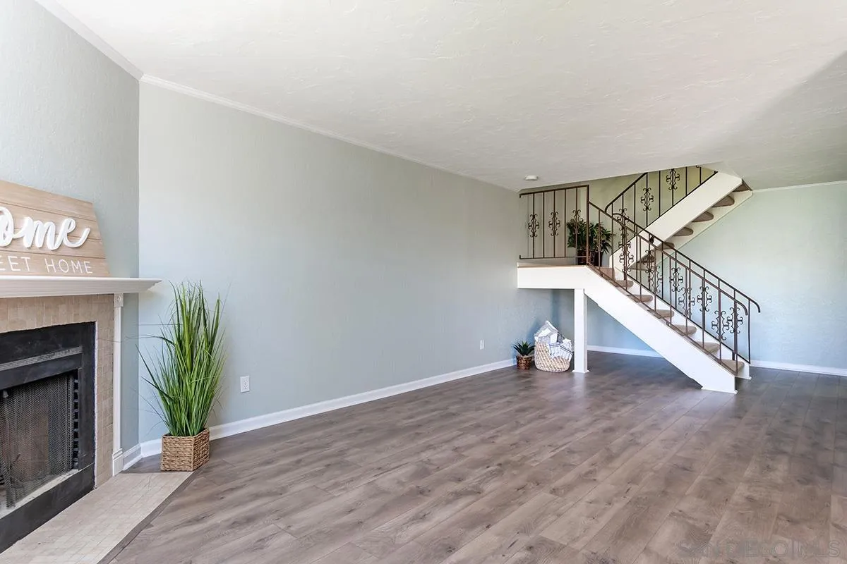705 Copper Drive Vista, CA 92083 - Photo 9 of 31 a view of entryway and hall with wooden floor