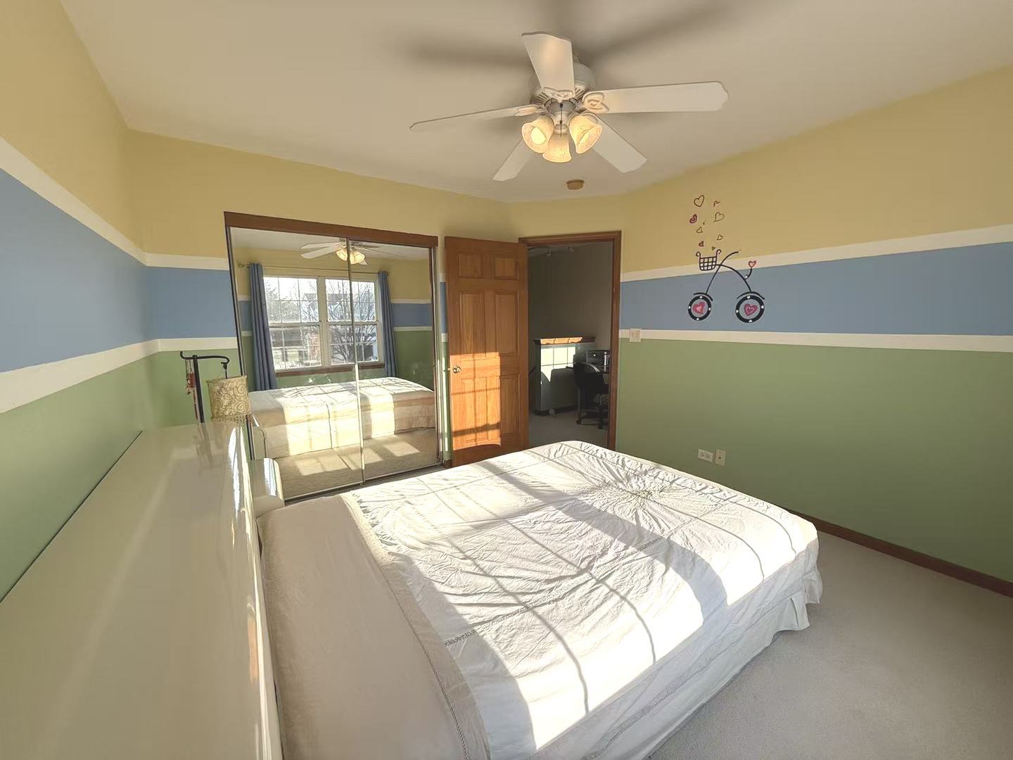 864 Genesee Drive Naperville, IL 60563 - Photo 14 of 31 a bedroom with a bed mirror and a window