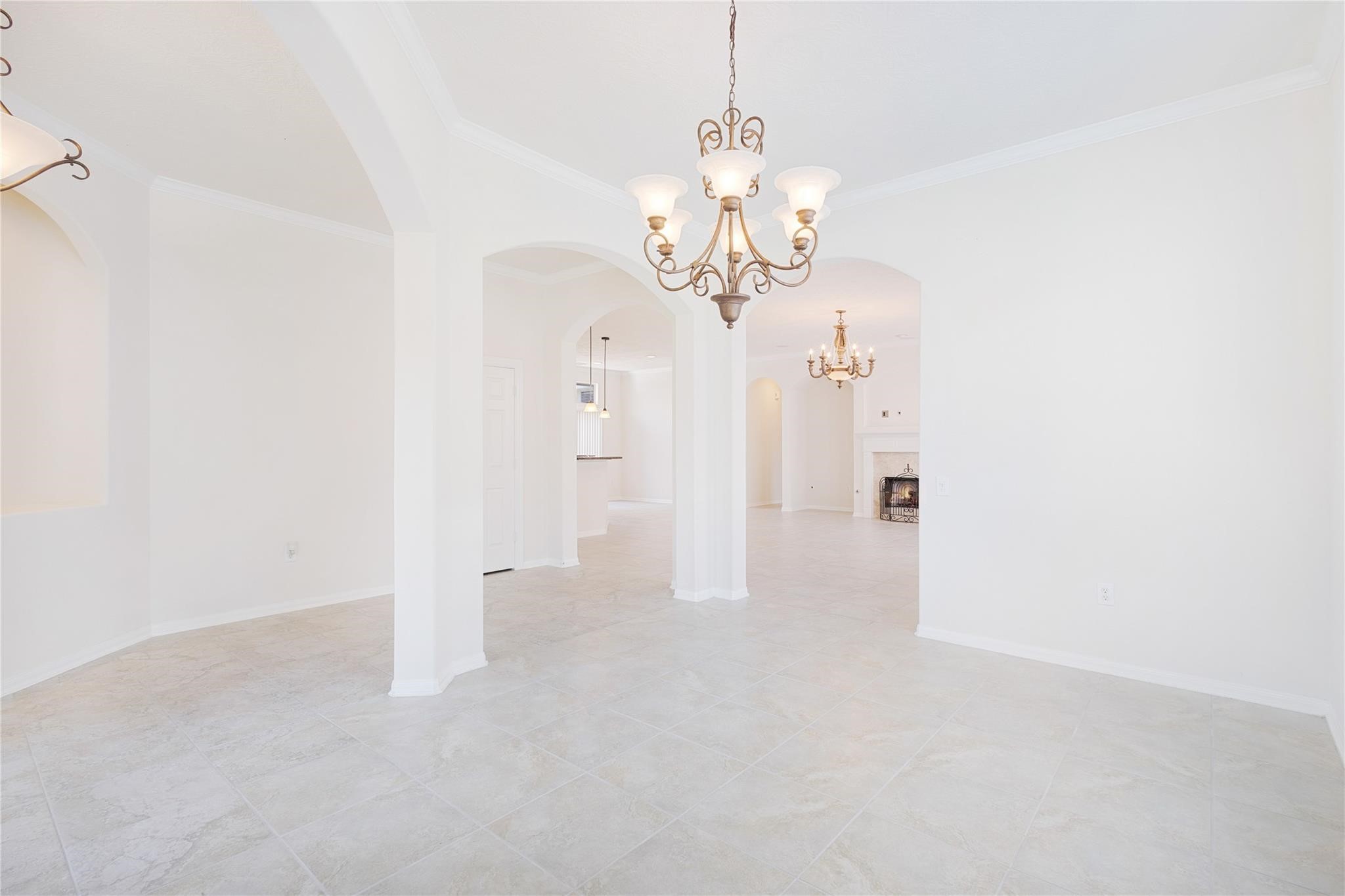 43 Tarrytown Way Conroe, TX 77384 - Photo 14 of 40 a view of a chandelier in an empty room