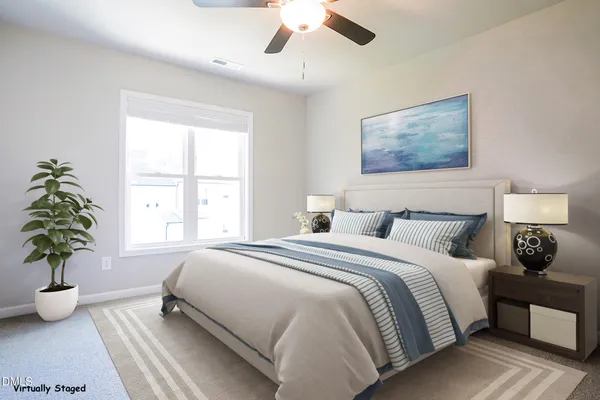 a bedroom with bed and a window