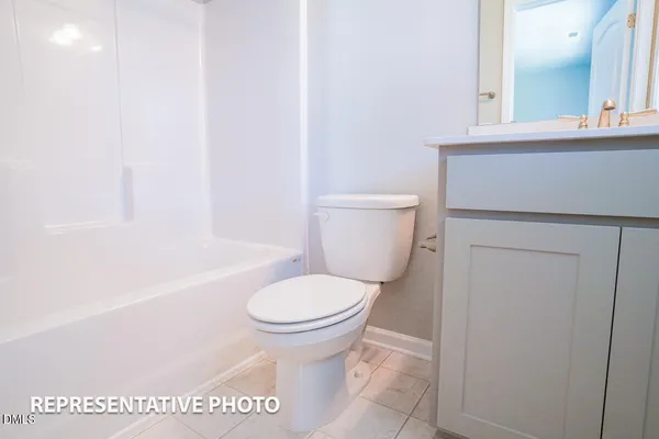 a bathroom with a toilet and a sink