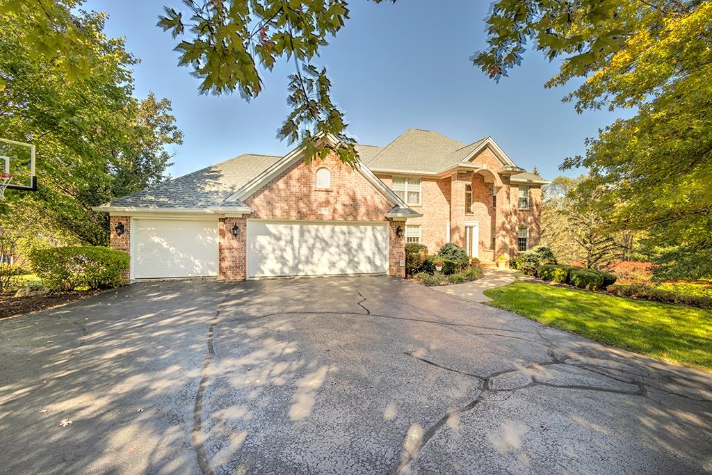 966 Spring Ridge Court Belvidere, IL 61008 - Photo 1 of 44 a view of a house with a yard and garage