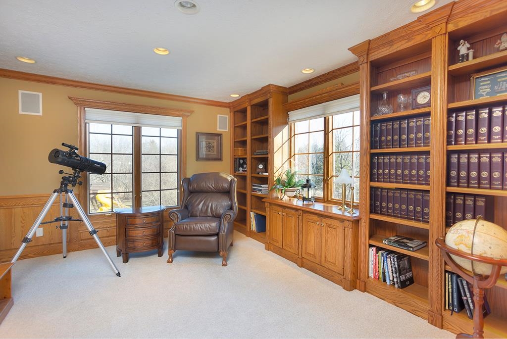 966 Spring Ridge Court Belvidere, IL 61008 - Photo 15 of 44 a living room with furniture a flat screen tv and a large window