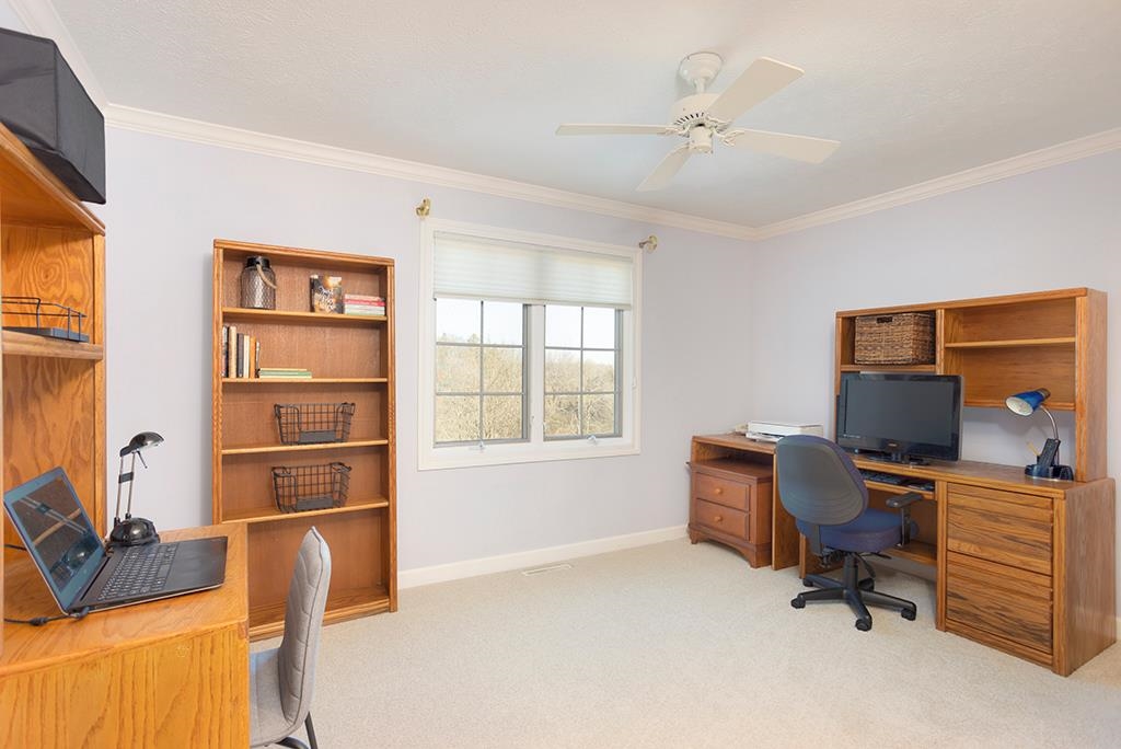 966 Spring Ridge Court Belvidere, IL 61008 - Photo 27 of 44 a view of a workspace with furniture and a window