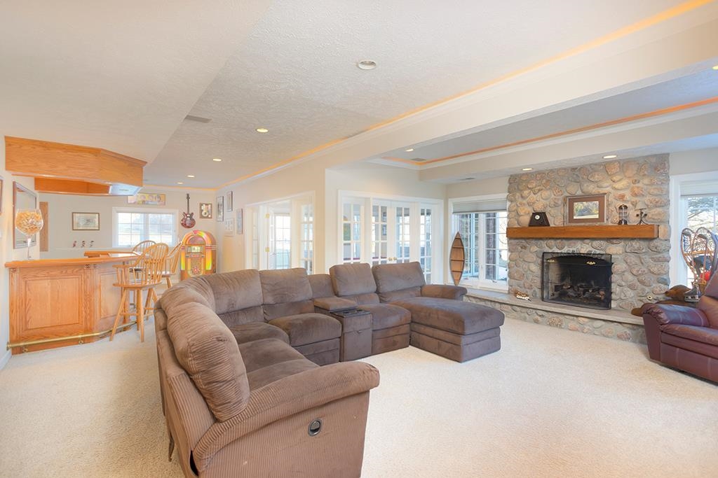 966 Spring Ridge Court Belvidere, IL 61008 - Photo 29 of 44 a living room with furniture and a fireplace