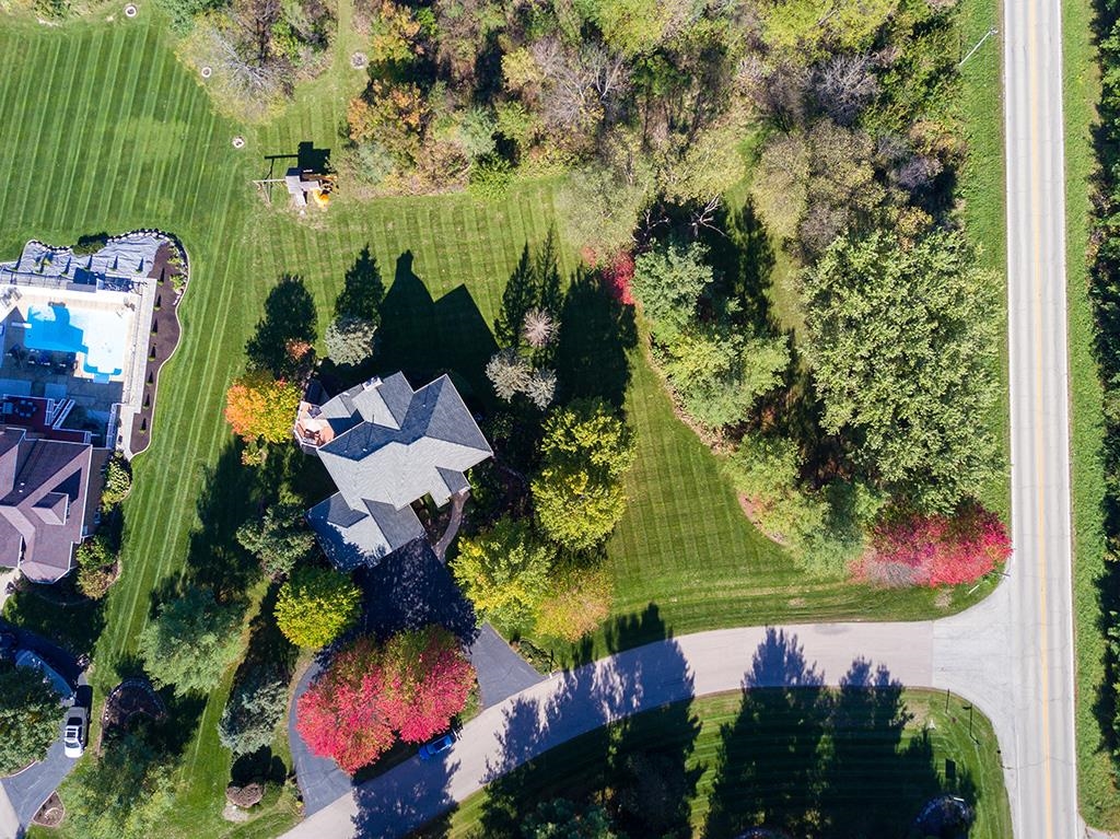 966 Spring Ridge Court Belvidere, IL 61008 - Photo 41 of 44 an aerial view of a house with a yard and potted plants
