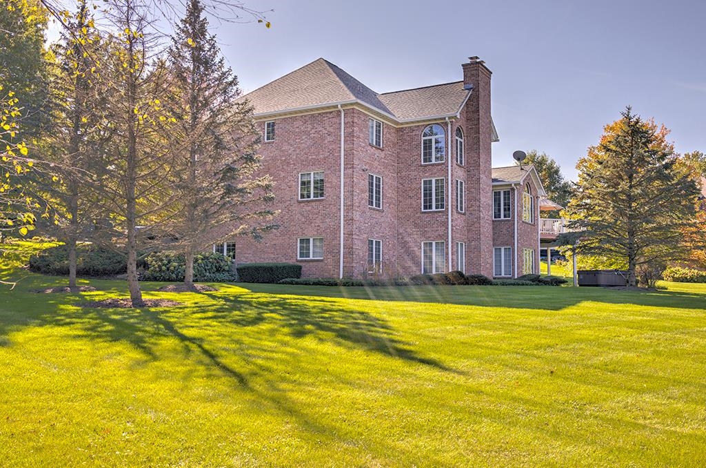 966 Spring Ridge Court Belvidere, IL 61008 - Photo 43 of 44 a view of a house with a swimming pool