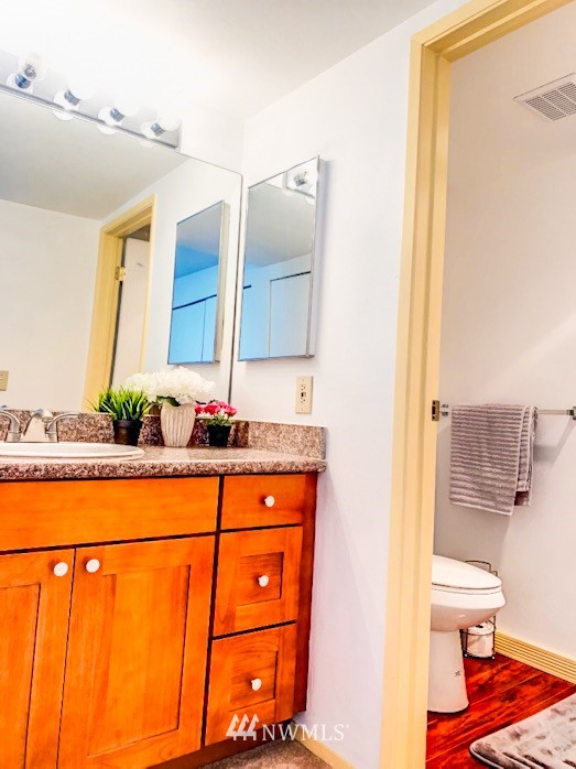 611 Southwest 5th Court, Unit A301 Renton, WA 98057 - Photo 13 of 17 a bathroom with a sink and a mirror