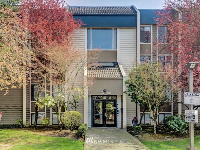 611 Southwest 5th Court, Unit A301 Renton, WA 98057 - Photo 17 of 17 a front view of a house with garden