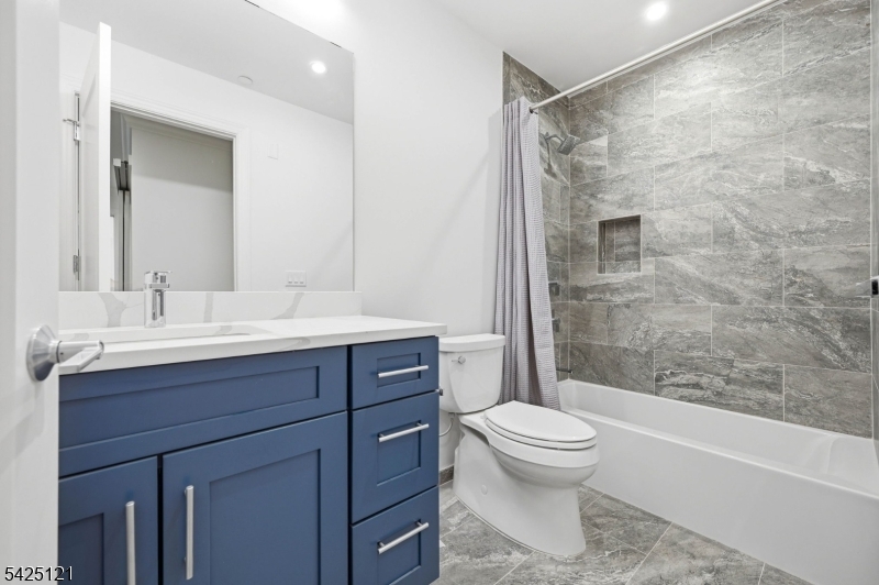 14 Ward Street Bloomfield, NJ 07003 - Photo 18 of 33 a bathroom with a sink toilet and shower