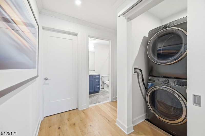 14 Ward Street Bloomfield, NJ 07003 - Photo 19 of 33 a view of a hallway with washer and dryer