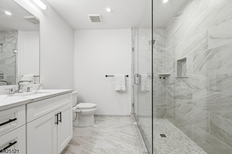 14 Ward Street Bloomfield, NJ 07003 - Photo 23 of 33 a bathroom with a toilet sink and a shower