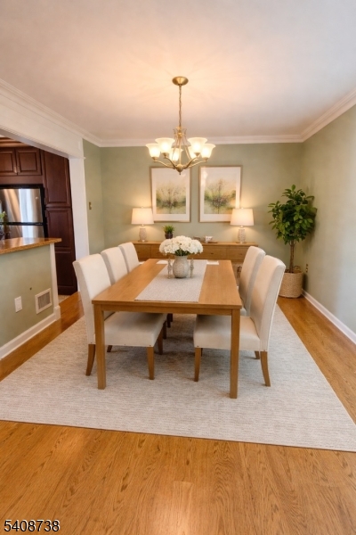 27 Espy Road, Unit A7 Caldwell, NJ 07006 - Photo 10 of 29 a dining room with a table and chairs