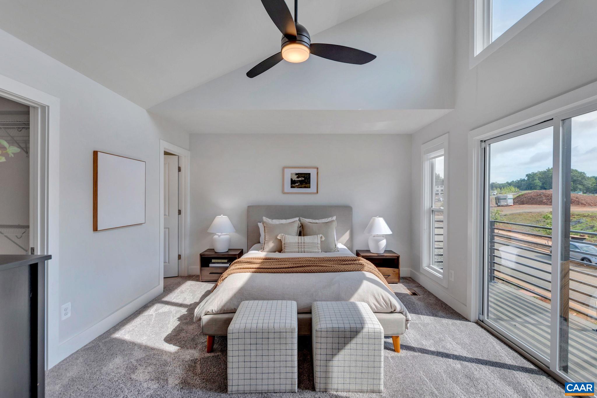 22 A Wardell Crest Charlottesville, VA 22902 - Photo 15 of 31 a bedroom with a large bed and a chandelier