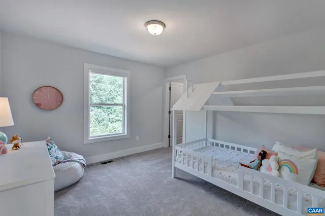 a bedroom with furniture and a window