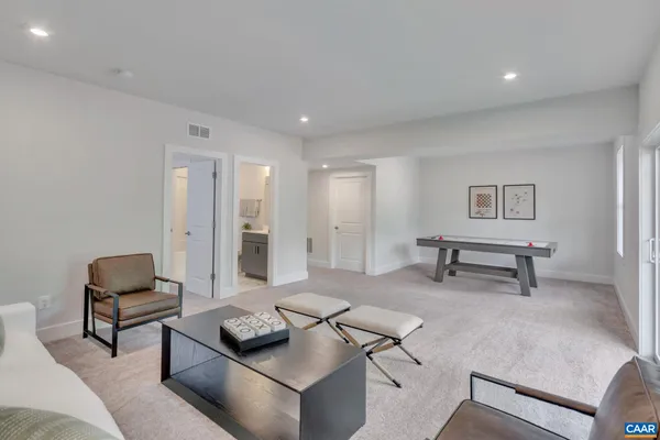 a living room with furniture and a rug