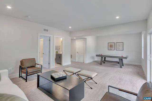 a living room with furniture and a rug