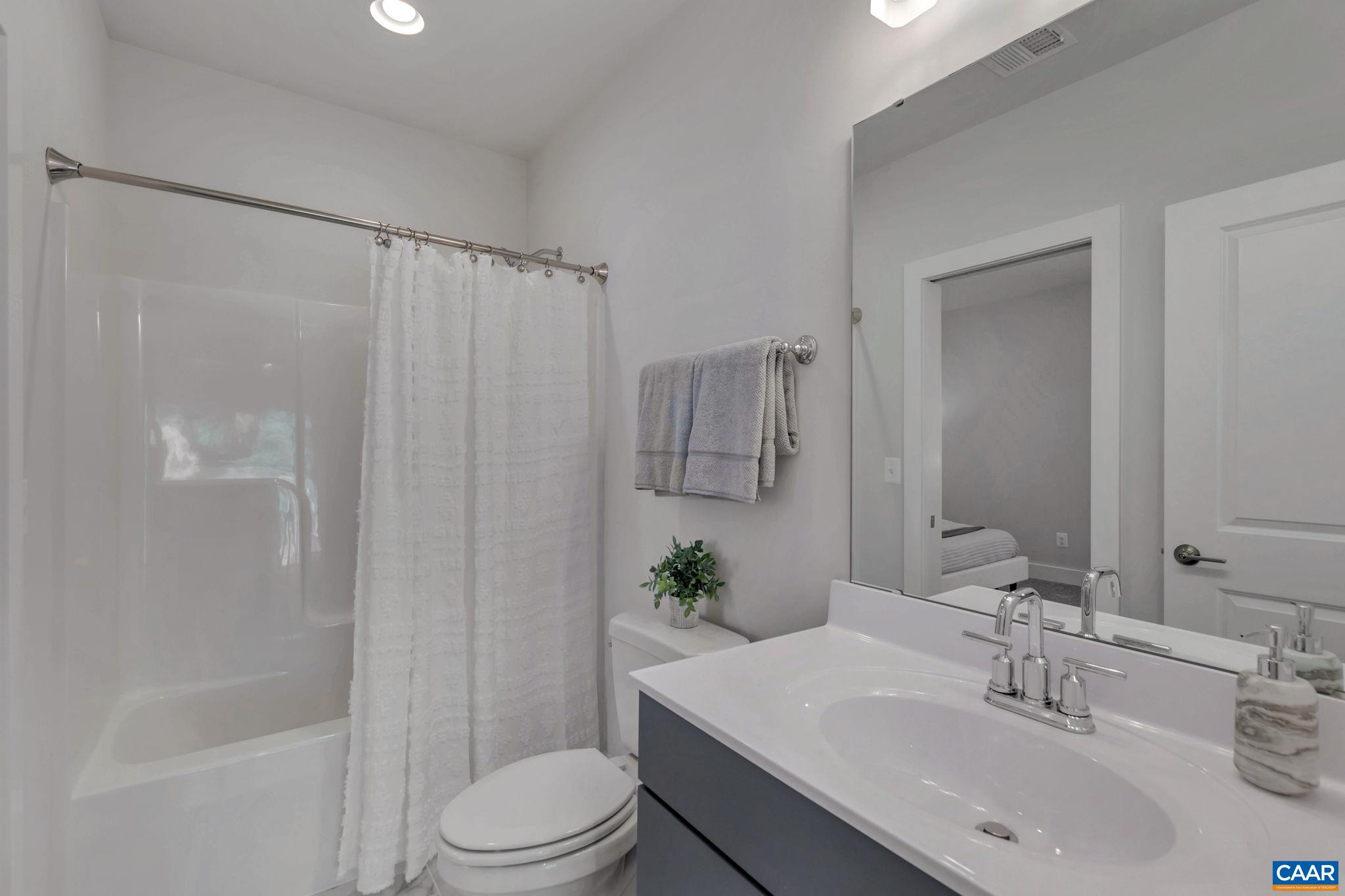 22 A Wardell Crest Charlottesville, VA 22902 - Photo 27 of 31 a bathroom with a sink toilet and shower