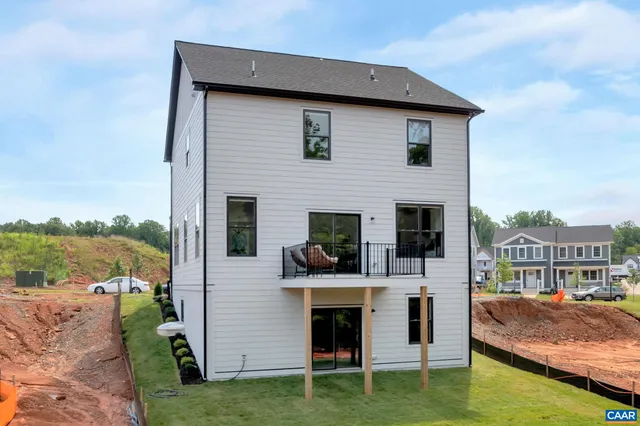 a view of house with swimming pool yard and furniture
