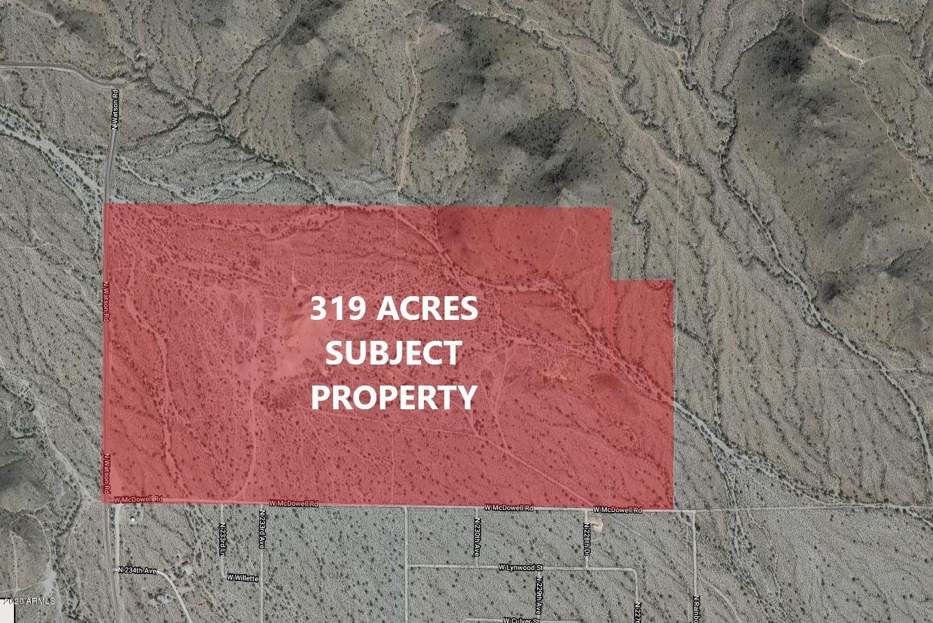 0 Nec Mcdowell & Watson Roads Buckeye, AZ 85396 - Photo 2 of 4 a sign that is sitting on a brick wall