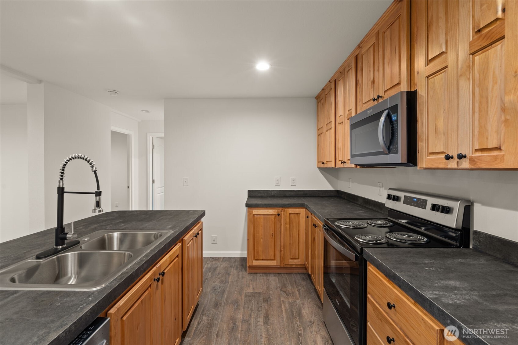 175 Boyd Road Randle, WA 98377 - Photo 11 of 26 a kitchen with stainless steel appliances granite countertop a sink stove and microwave