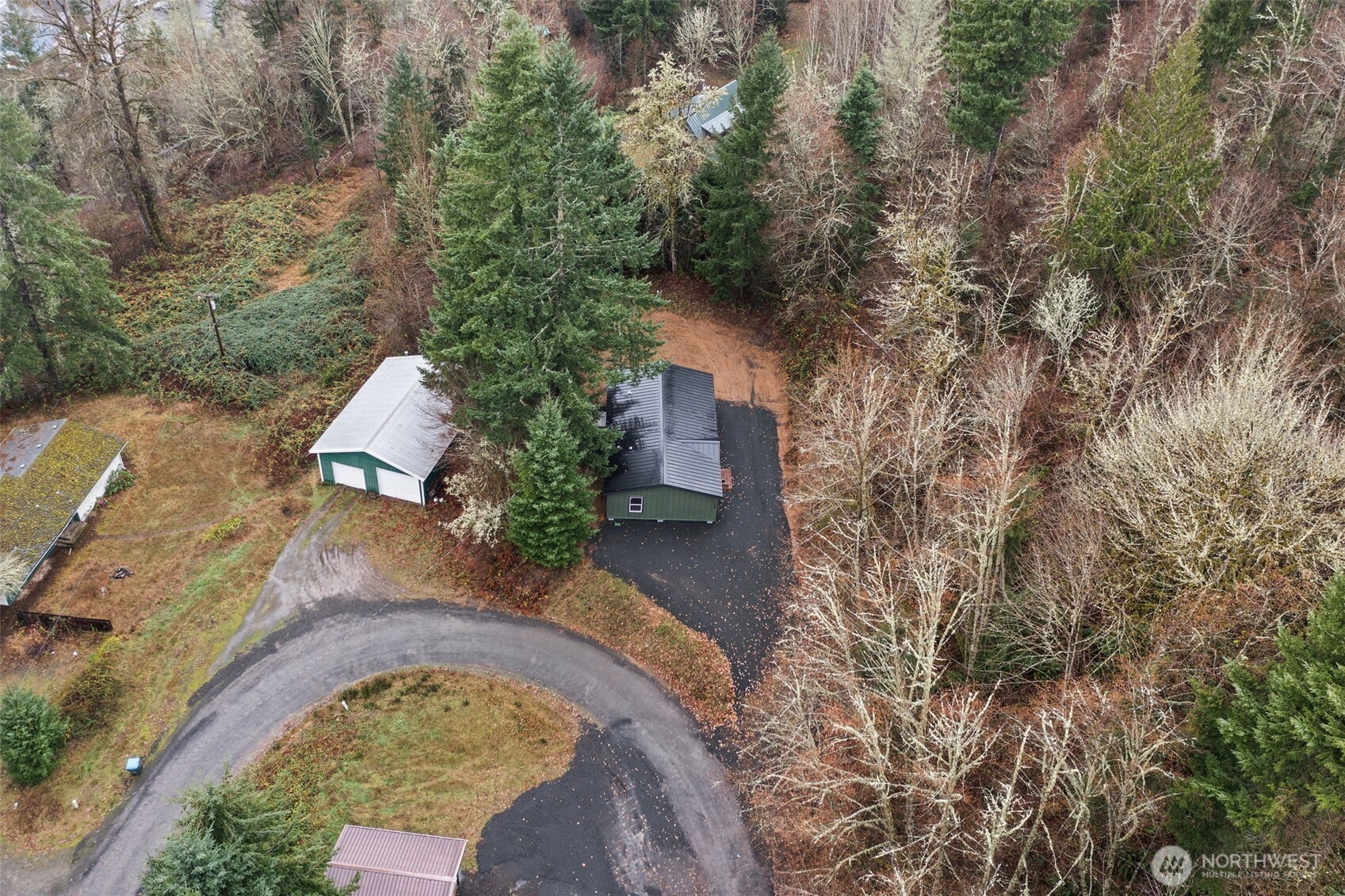 175 Boyd Road Randle, WA 98377 - Photo 22 of 26 an aerial view of a house with a yard and trees all around