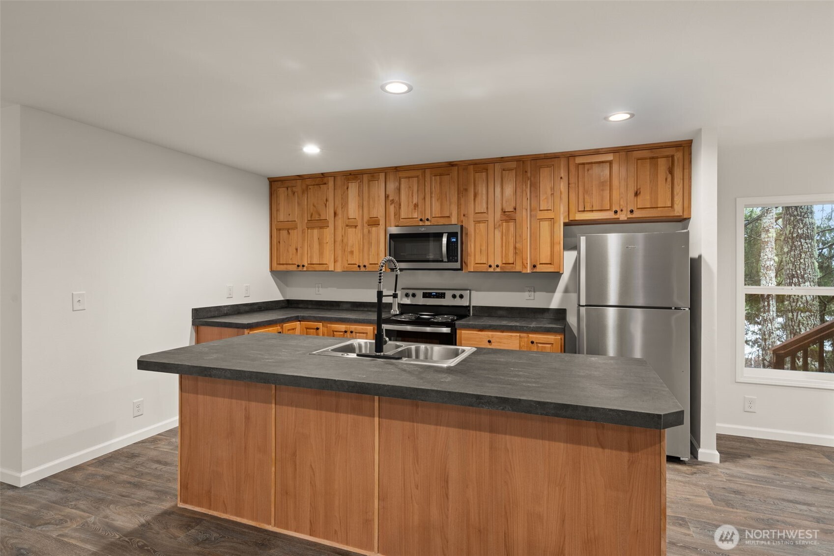 175 Boyd Road Randle, WA 98377 - Photo 10 of 26 a kitchen with stainless steel appliances granite countertop a refrigerator a sink a stove a microwave and island