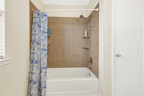 a bathroom with a shower curtain