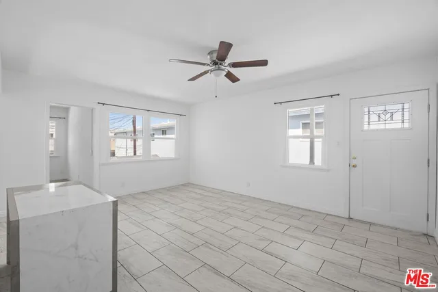 a kitchen with a sink and a stove top oven