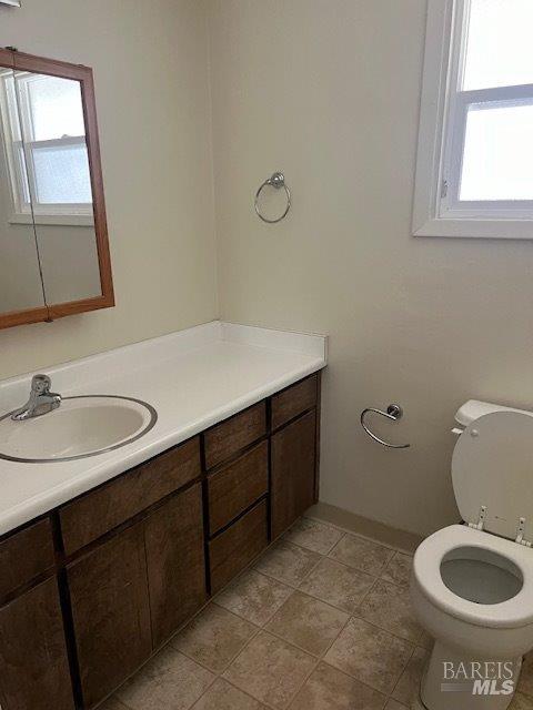 689 Plum Drive Santa Rosa, CA 95404 - Photo 19 of 26 a bathroom with a sink toilet and mirror