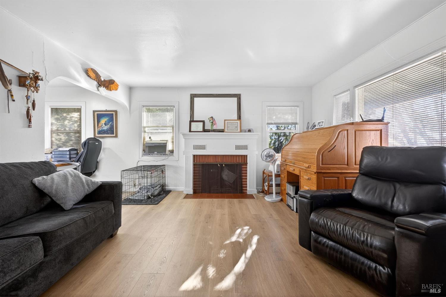 689 Plum Drive Santa Rosa, CA 95404 - Photo 3 of 26 a bedroom with furniture and a fireplace