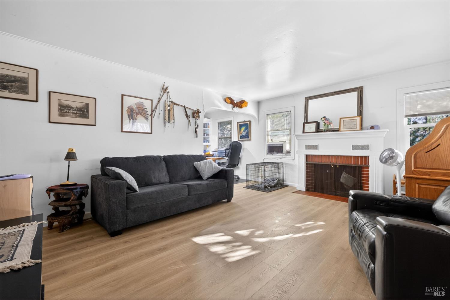 689 Plum Drive Santa Rosa, CA 95404 - Photo 4 of 26 a living room with furniture a flat screen tv and a fireplace