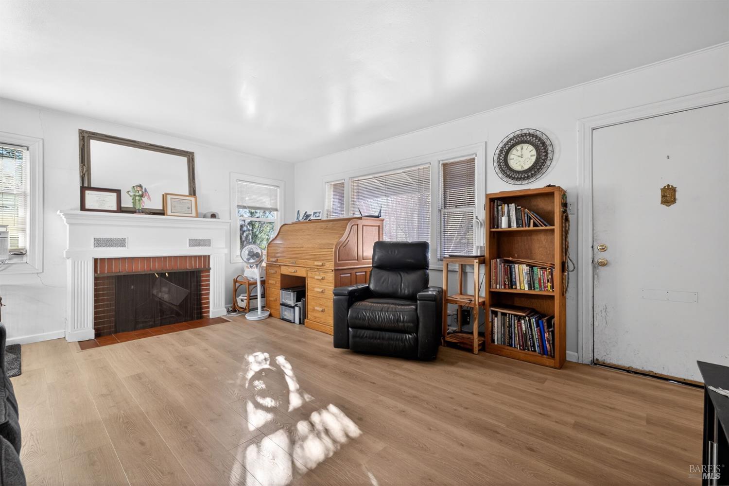 689 Plum Drive Santa Rosa, CA 95404 - Photo 5 of 26 a living room with furniture and a fireplace