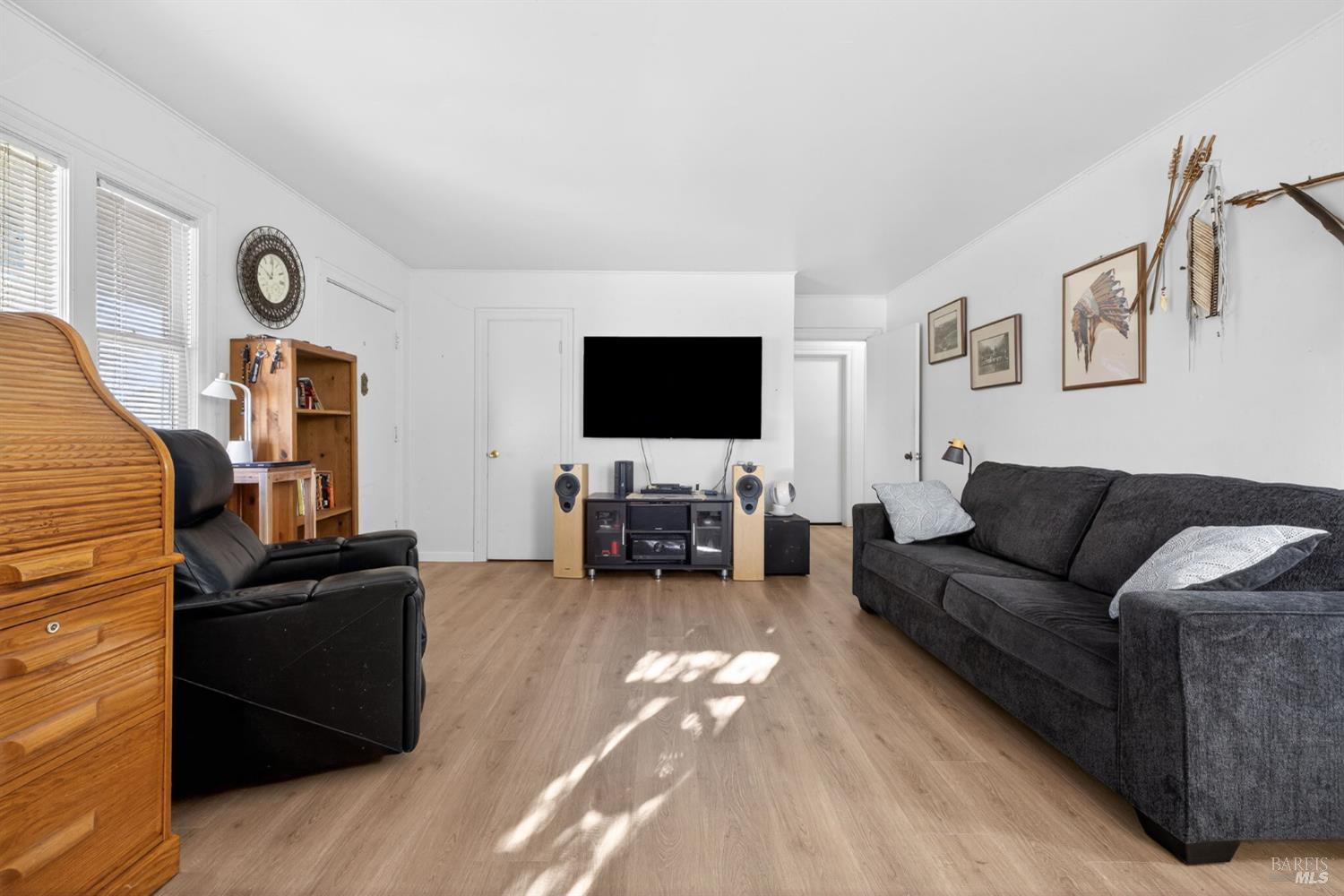 689 Plum Drive Santa Rosa, CA 95404 - Photo 6 of 26 a living room with furniture and a flat screen tv